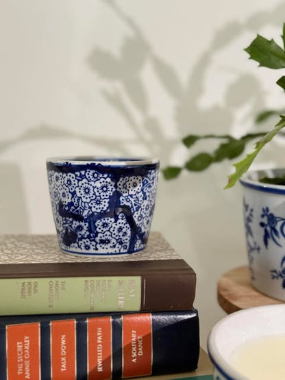 This exquisite candle features a captivating blue and white design, reminiscent of classic Chinese porcelain, adding a touch of timeless elegance to any space.